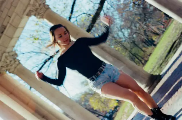 Lucy at a tilted angle in an edgy denim shorts look