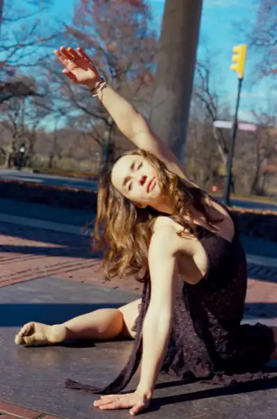 Seated pose reaching upward, intimate moment