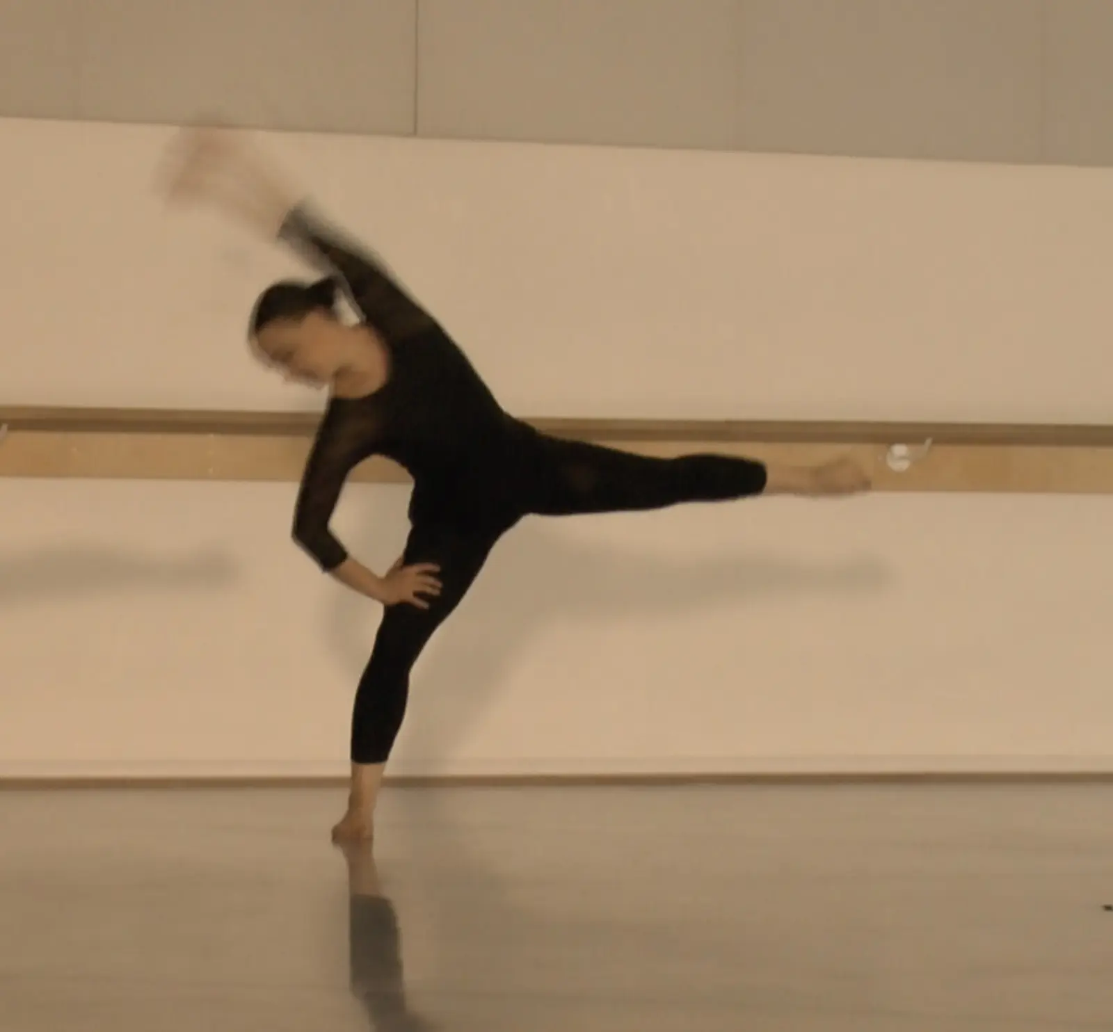 Lucy in a Graham-inspired modern dance attitude pose